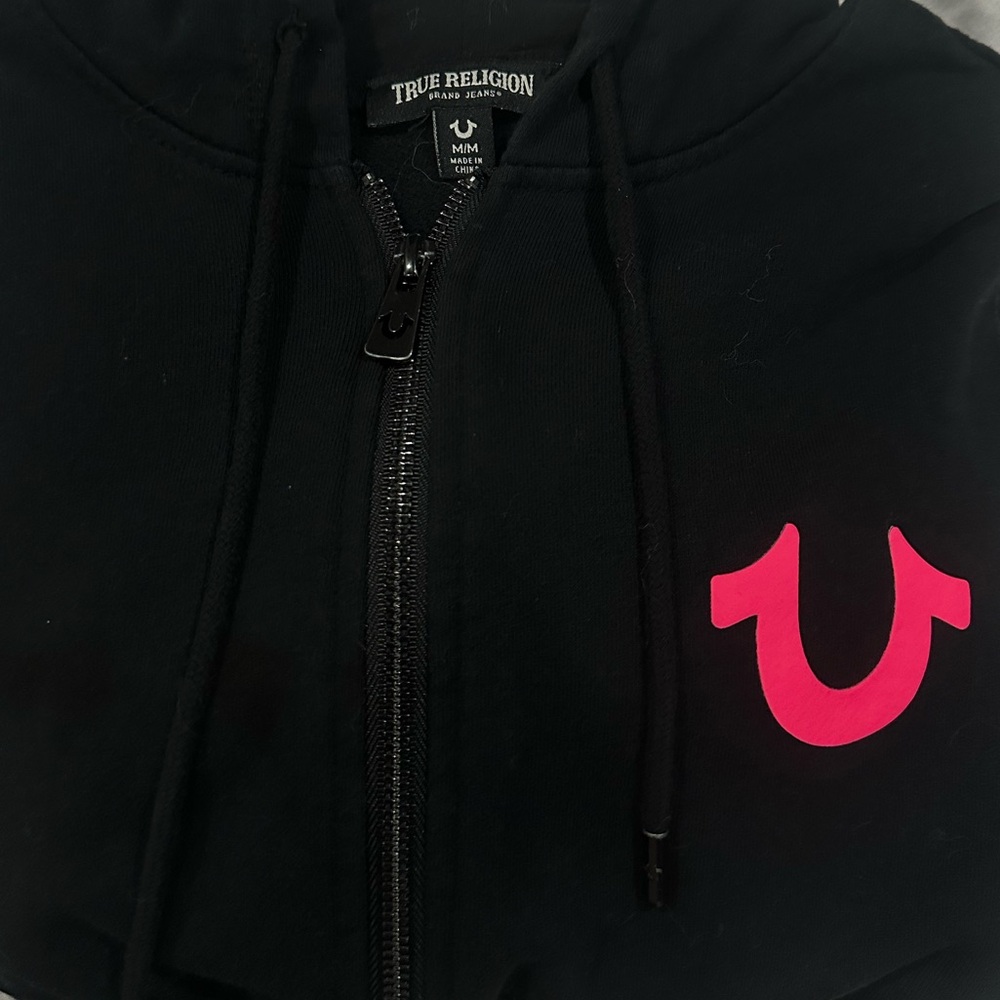 pink logo true religion